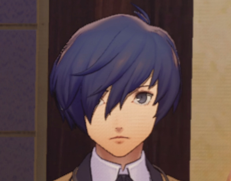 An image of the protagonist from Persona 3 Reload looking straight on at the camera. The expression is dead-pan, autistic stare.